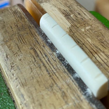 Repair of a lifting bridge, and making bone saddles for this one.
This was a guitar of one of the -what I consider to be- big names in the industry. I guess it happens in the best of families.
#guitar #repair #guitarrepair #acousticguitar #steelstring